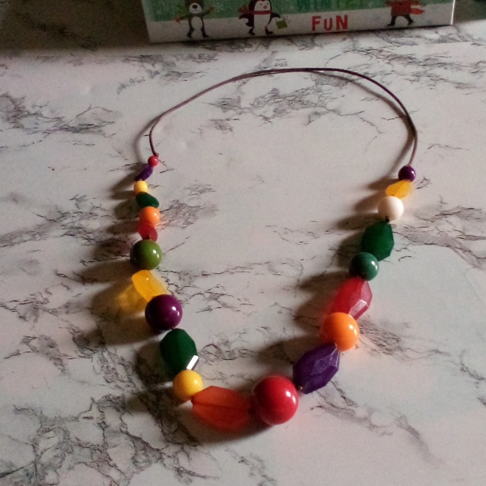 Vintage multi-color multi-shape acrylic necklace on a rope chain
